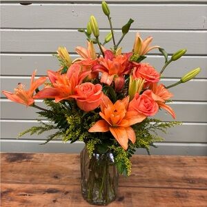 Orange Floral Arrangement in Glass Vase